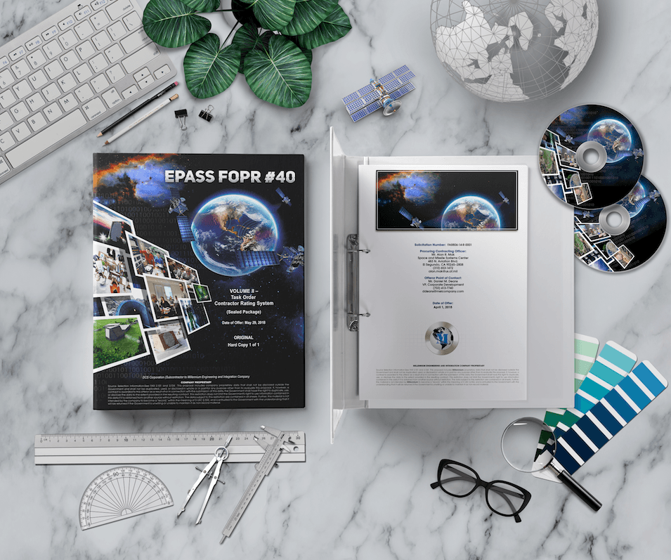 Styled desktop scene mockup showing the EPASS FOPR proposal binder, two CDs, drafting tools, and a color swatch on a marble surface